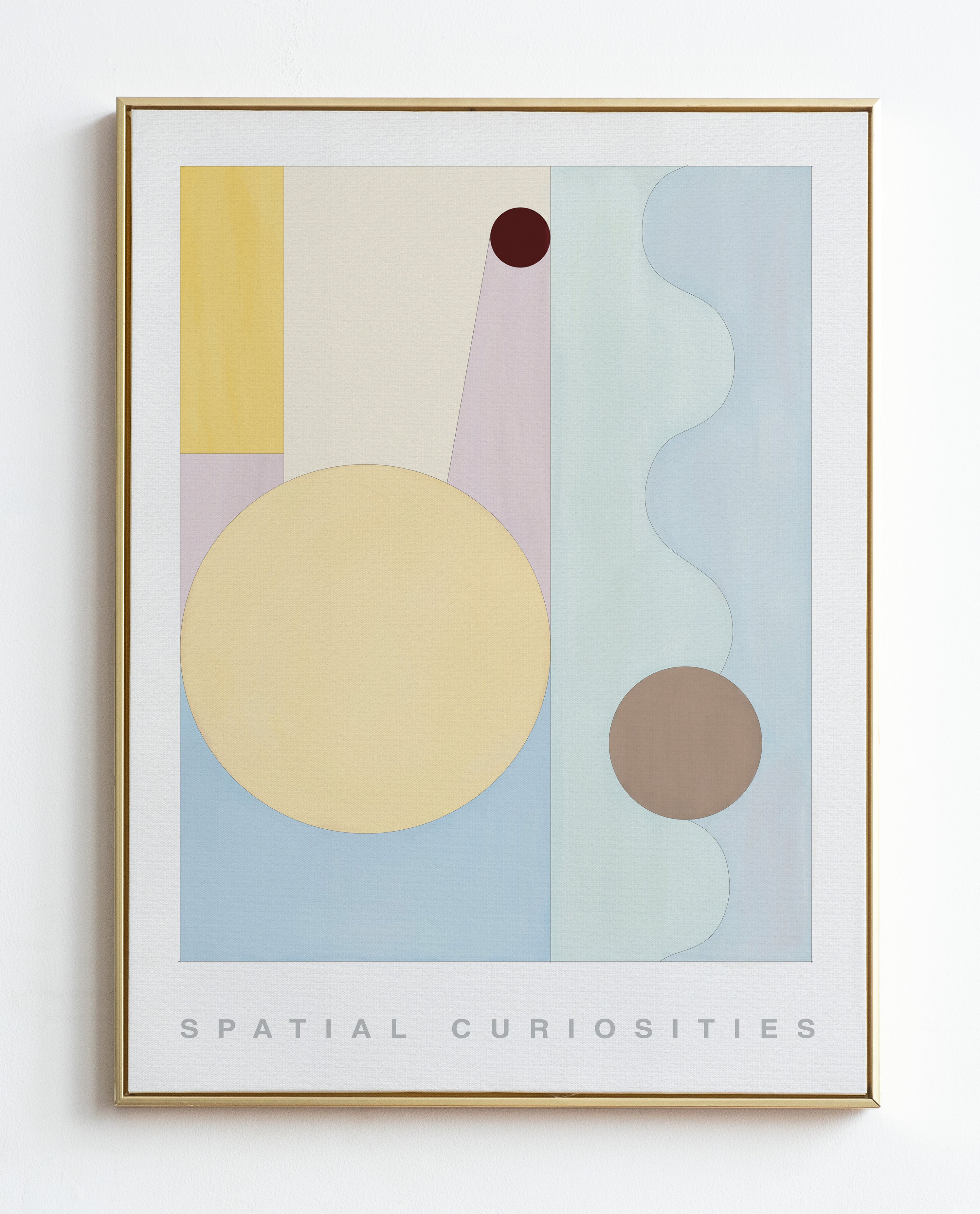 Framed abstract art print with geometric shapes on a white wall
