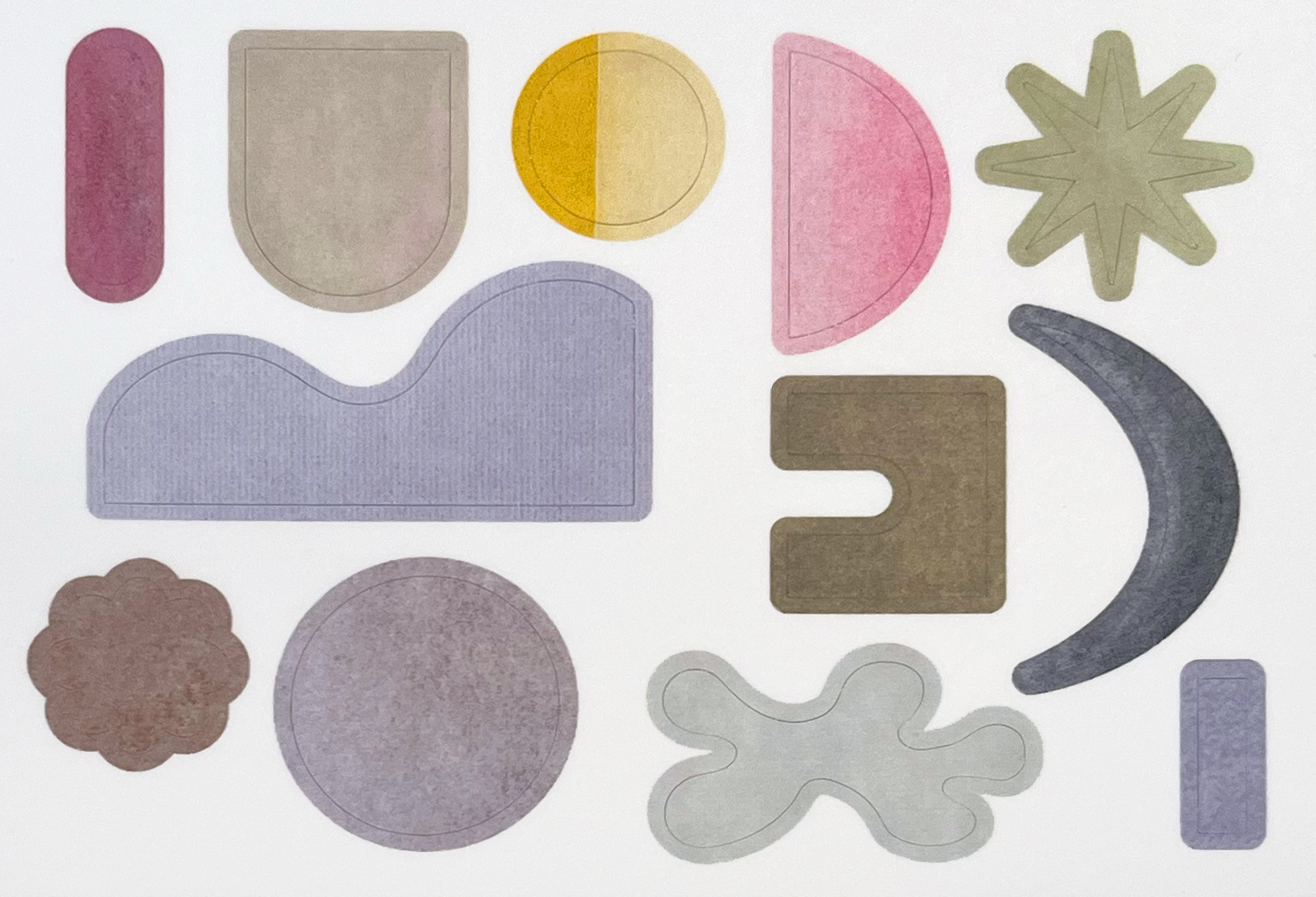 Set of colorful geometric rug shapes on a white background