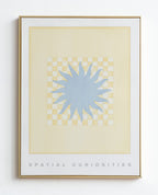 Framed artwork with a blue abstract design on a beige background, titled 'Spatial Curiosities'.