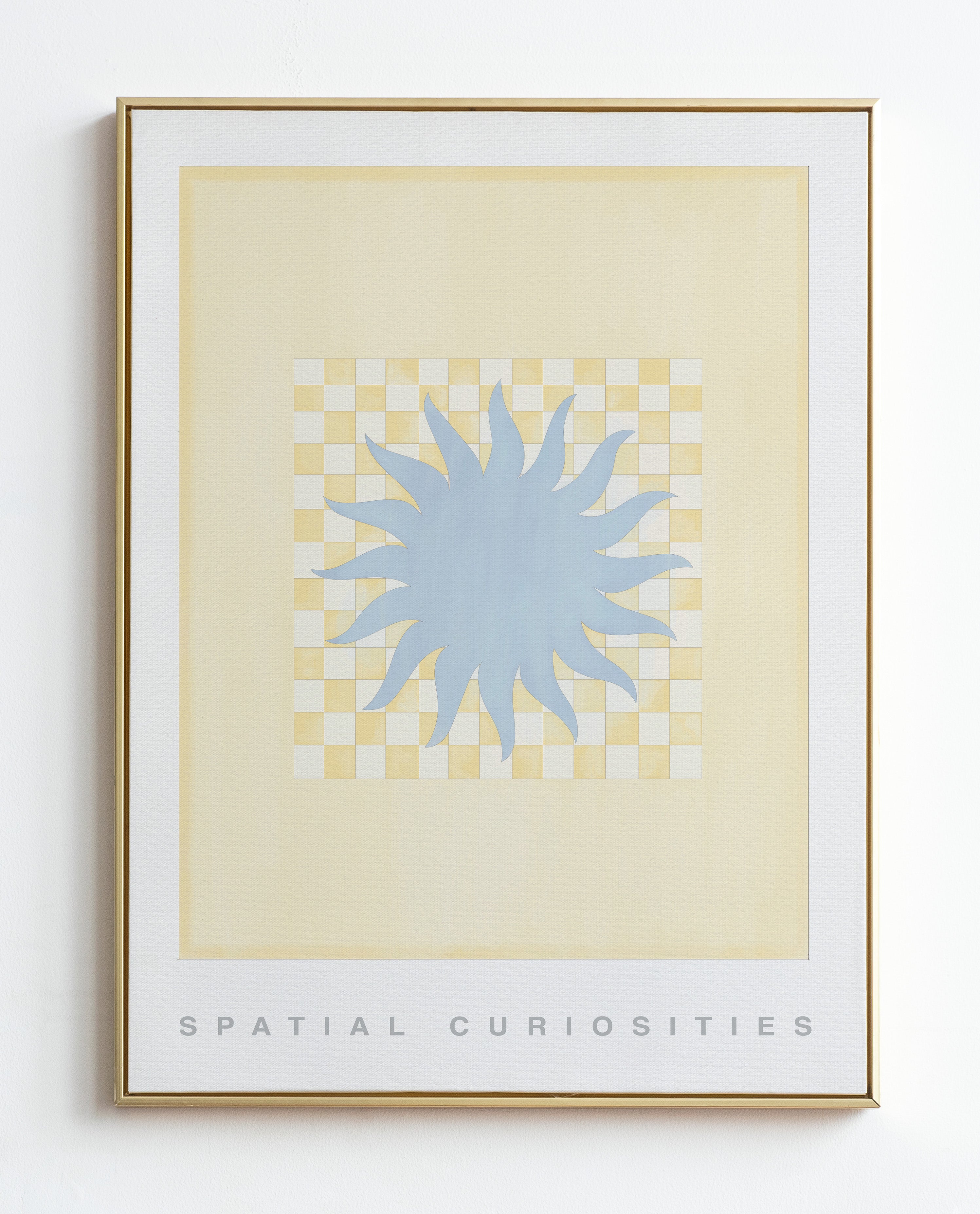 Framed artwork with a blue abstract design on a beige background, titled 'Spatial Curiosities'.